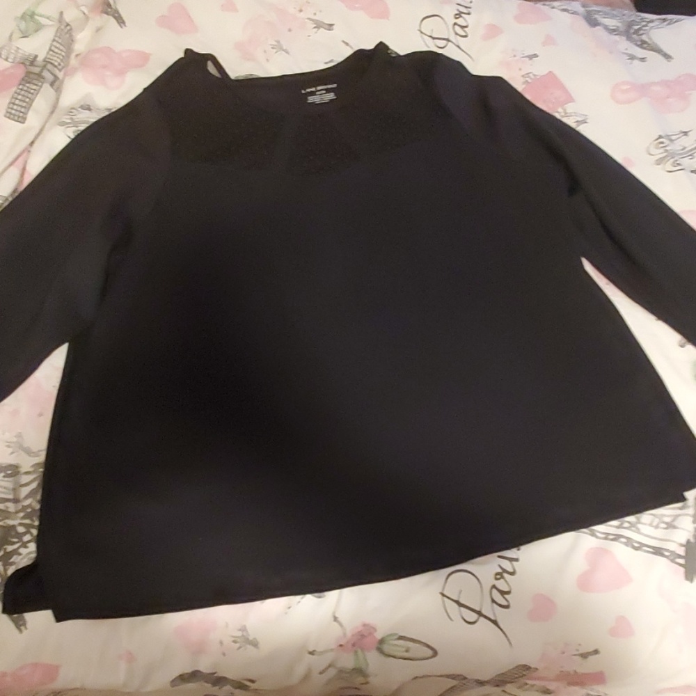 Black blouse with see through detail.